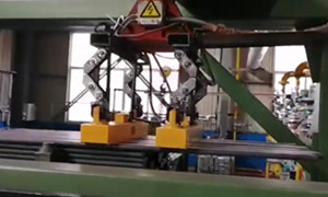 Magnetic Grippers on Robotic Gantry System Handling Steel Tube in Row